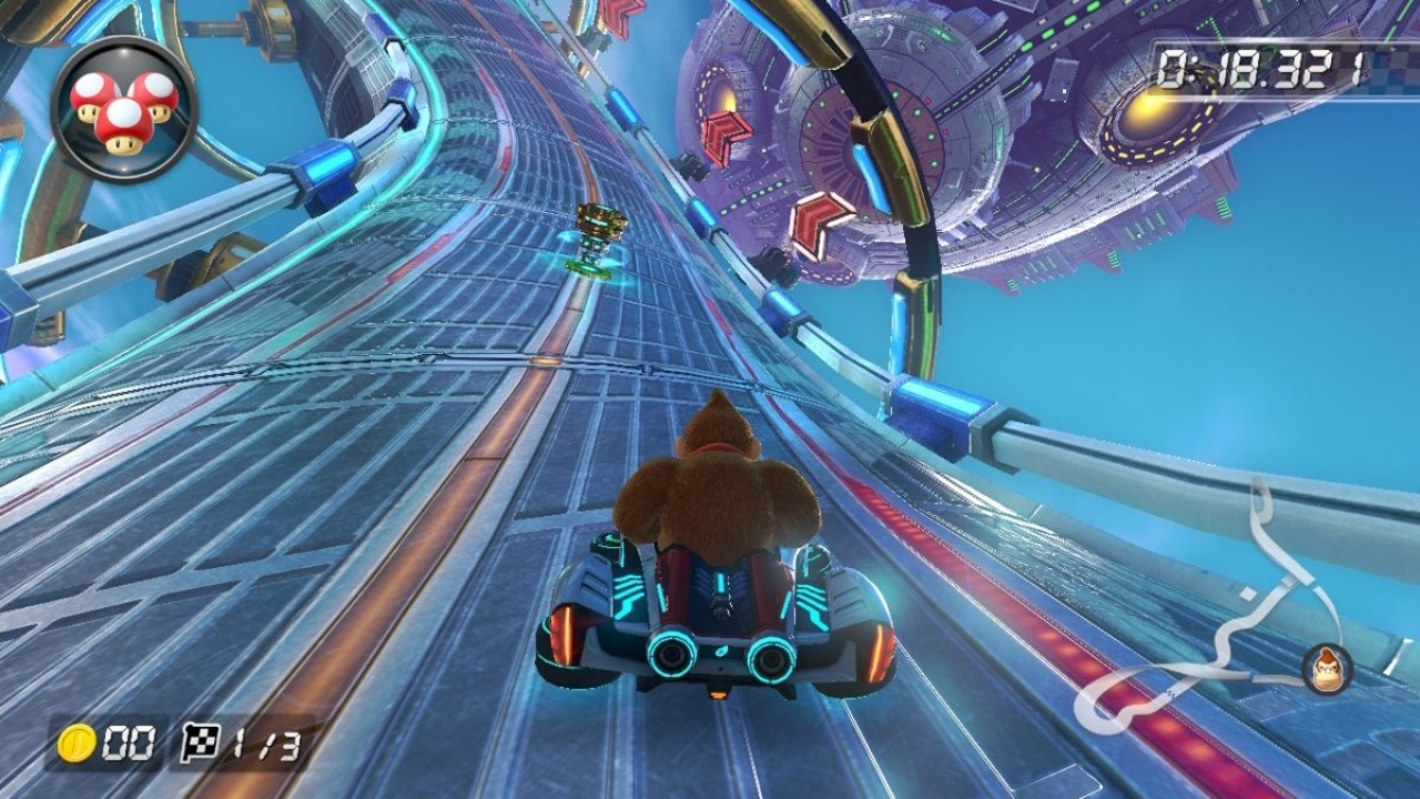 Rear-view of Donkey Kong riding in a kart on the Mute City track. 