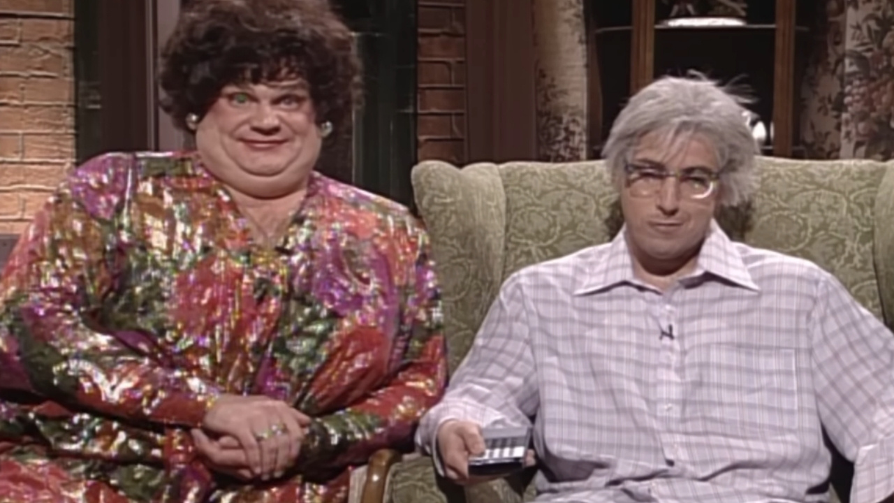 Chris Farley and Adam Sandler on the "Zagat's with Hank & Beverly Gelfand" sketch for SNL, Saturday Night Live. Hank and Beverly Gelfand (Adam Sandler, Chris Farley), the hosts ""Zagat's,"" are celebrating their anniversary and Beverly wants to find a restaurant, but Hank just wants sweet relief. Too bad his sister-in-law (David Duchovny) has stopped by. [Season 20, 1995]