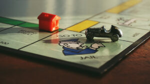 Monopoly hotrod die cast model on traditional game board. vintage board games