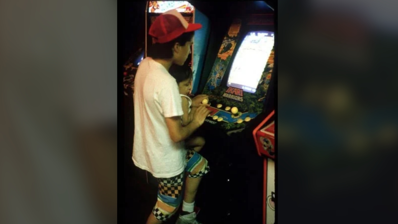 siblings playing arcade