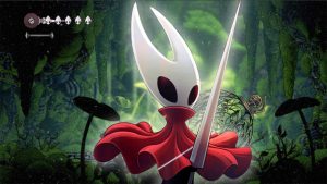 'Hollow Knight: Silksong' protagonist Hornet glows in foreground; in-game stage shown in background
