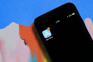 Apple iPhone screen shows App Store app in top-left corner. The app shows four unopened push notifications. (Outrun Gaming: How 'Fortnite,' 'Roblox' continue to influence mobile gaming regulations)