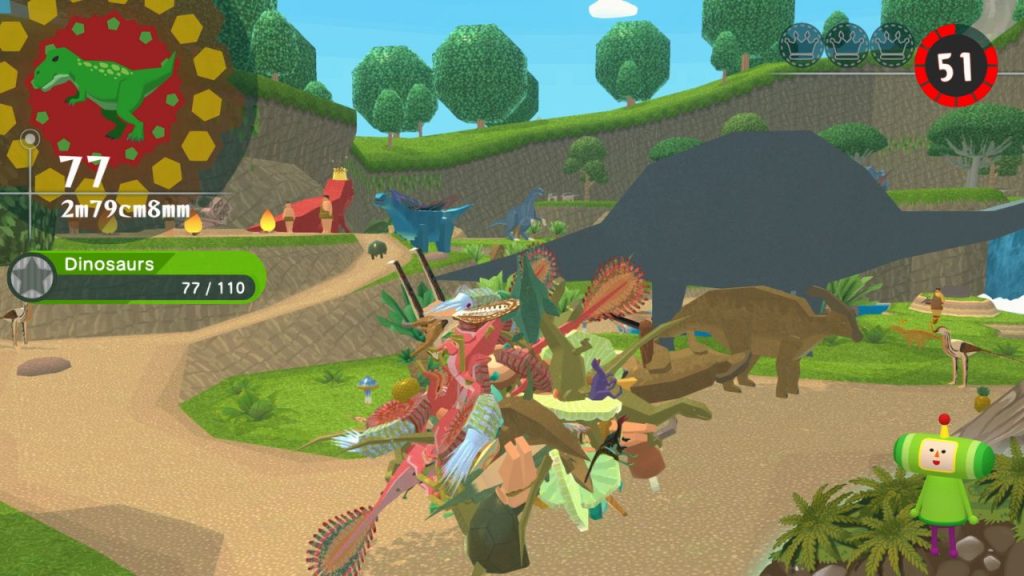 Once Upon A KATAMARI | Outrun Gaming Screenshot from 'Once Upon A KATAMARI' shows The Prince and rolling katamari pick up a green t-rex figure. (Outrun Gaming: 'Once Upon A KATAMARI' rolls onto consoles, Steam)
