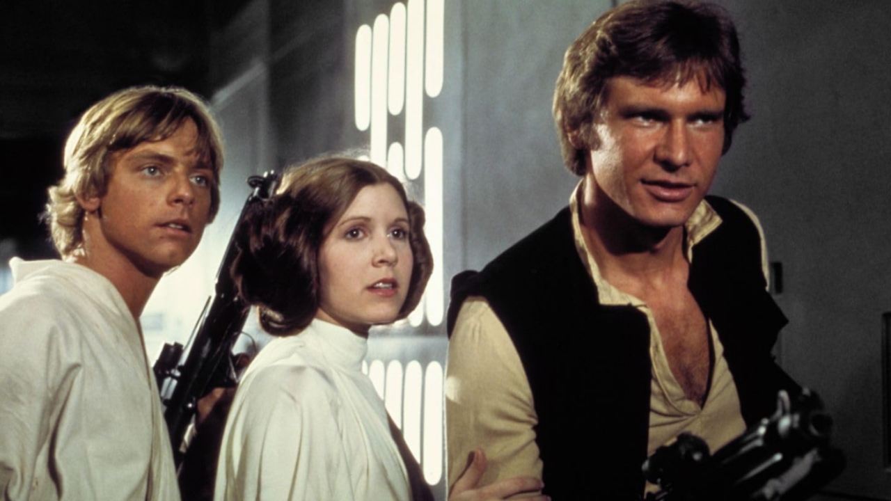 Luke, Leia, and Han Solo stand in a starship corridor, weapons drawn, looking tense. 🎮 Outrun Gaming