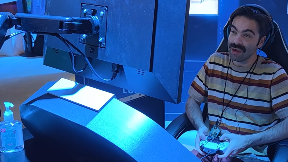 Jacob Geller in MinnMax "PAX 2026 Travelogue" on YouTube (© MinnMax) | Outrun Gaming Jacob Geller in MinnMax "PAX 2026 Travelogue" on YouTube (© MinnMax) | Outrun Gaming